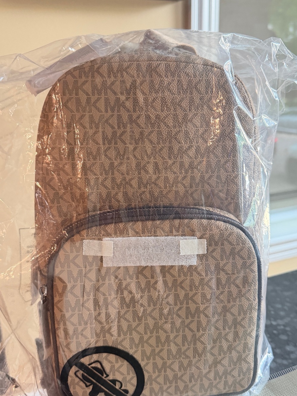 Michael Kors Tan Monogram sling Bag